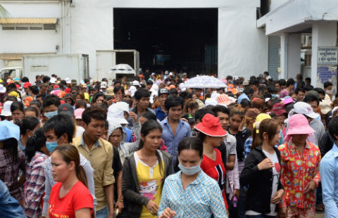 Garment factory workers leave the Roo Hsing garment factory for their lunch break in Phnom Penh.