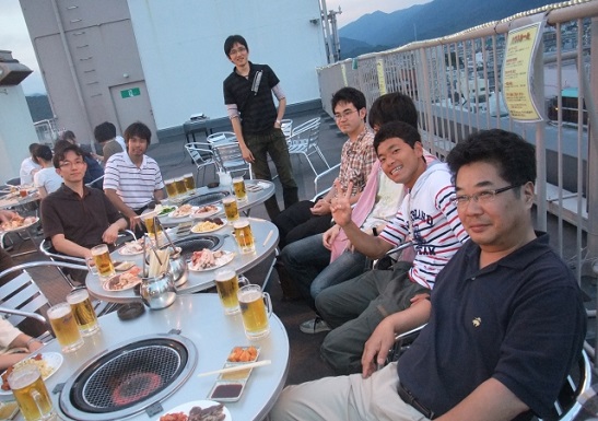 Mori at a social gathering with his students and colleagues. Credit: Mori Research Laboratory.